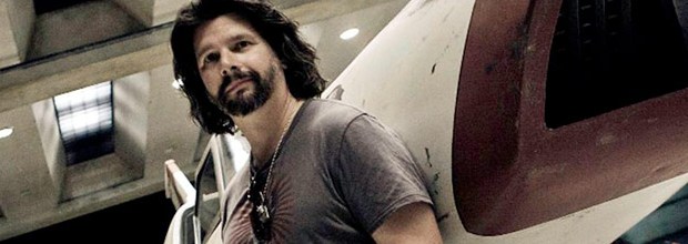 Ronald D Moore in front of a viper from battlestar galactica